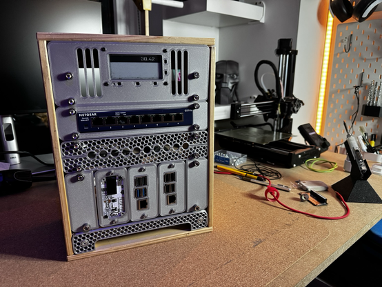 It’s a mini server rack inside a little wooden crate bunch of maker junk in the background 