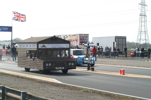 Picture of a Shed on a Drag Race track. 