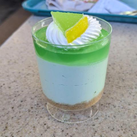 Lime parfait - layers of graham cracker crust, lime cream cheese mousse, and lime-orange gelée topped with chantilly.
