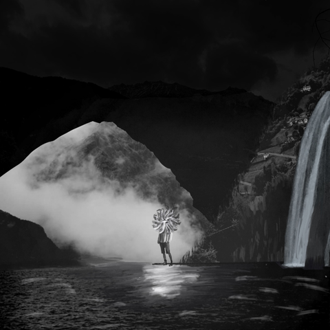 Cover picture of the single (black and white boy between mountains and a lake, collage).