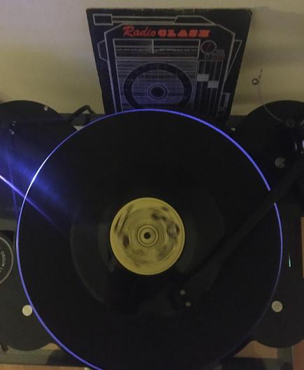 the radio clash 7" playing on a blue light tinted record player