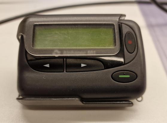 Classic pager made from grey plastic. It doesn't display anything right now.