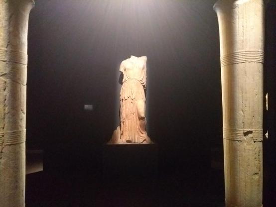 Stunning marble centrepiece of the goddess Demeter c420 BC framed by 2 marble columns, Eleusis Museum, Greece.