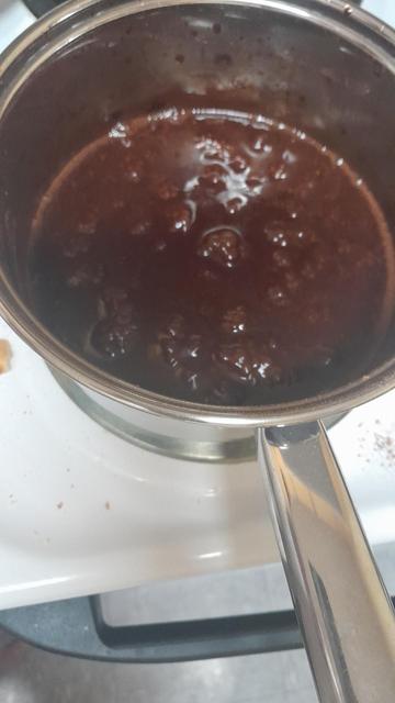 Boiling chocolate syrup in a pan