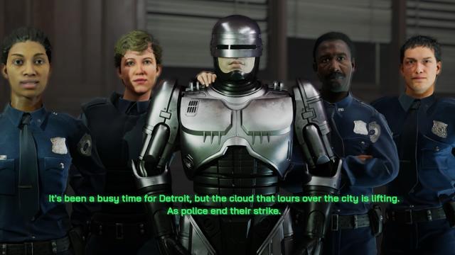 A group of four police officers stands together, including a humanoid robot, in a scene referencing Detroit. The robot, resembling a character from a popular movie, is in the center, while the officers, wearing uniforms, display various expressions.
