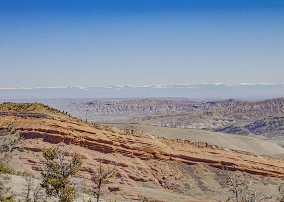 nice orange sandstone ridge on the way back down into the desert of the Bighorn Basin. Bighorns way out east in back. 