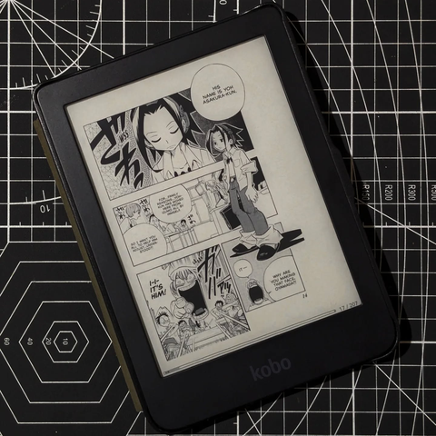 A Kobo Clara HD showing a manga panel from Shaman King.