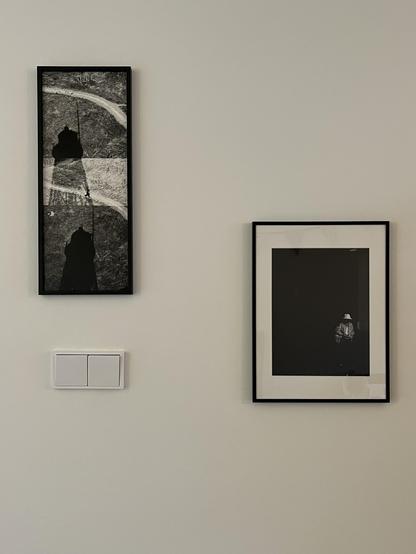 two black and white frames on a wall