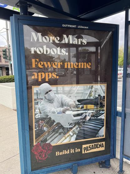 Bus ad that says “more Mars robots. Fewer meme apps”