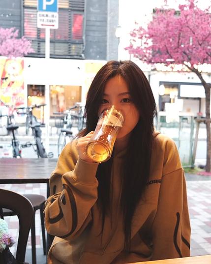 photo of wheein drinking beer.