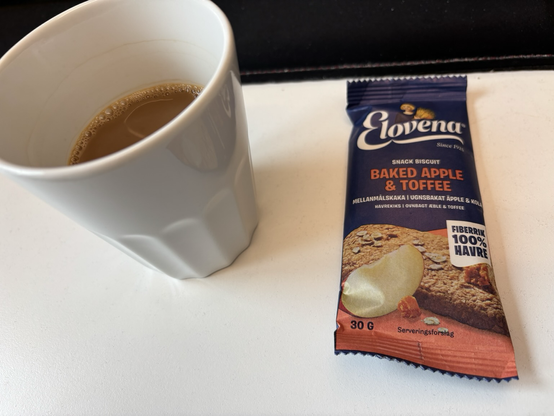 Cup of coffee and elovena brand oat biscuit 