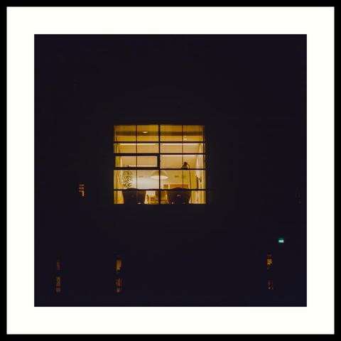colour - Nighttime analog photograph of a first floor office space seen from outside. The building itself is not illuminated from outside and this specific office is the only one that has all the lights on. Decided to shoot this on film because it handles this kind of situation much nicer than digital in my opinion. This film gives you slightly washed out blacks, nice looking highlights and an overall warmth and softness.