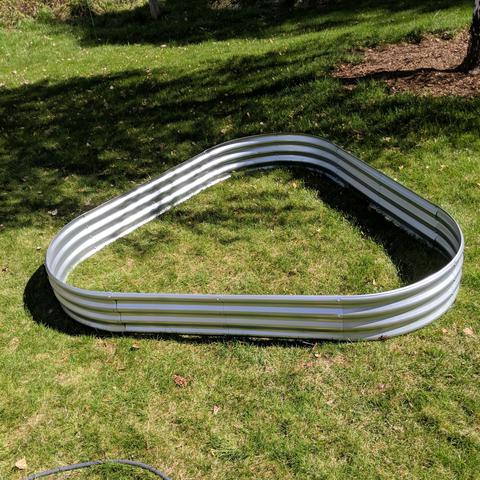Version 1 of the alternate shape, a triangle that is about 6 feet on each side. These are foot tall corrugated metal panels. flat pieces are about 2 feet long, curved pieces are also about 2 feet from edge to edge in a straight line. 3 curves make half of a circle.