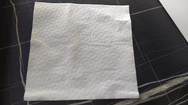 Tissue embossed with its logo, that says:

nani
