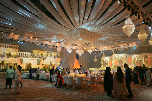 image contains people gathered for a wedding event happening in Neo Convention hall hyderabad