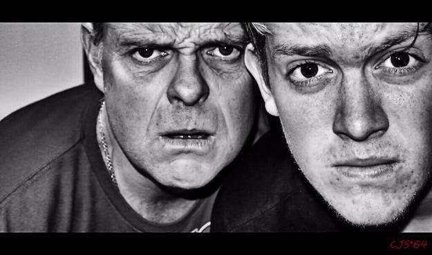 black and white photograph of a close-up of two men staring at the camera. Photo attribution: Flickr user Craig Sunter