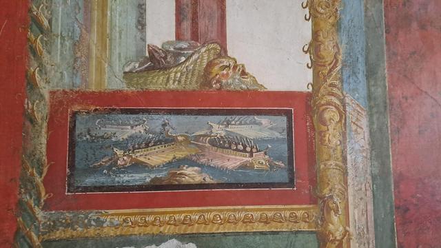 Photo of a detail of a fresco at Pompeii with two more Roman or Greek galleys  ... all these are details of a wider scene with red and black paint borders