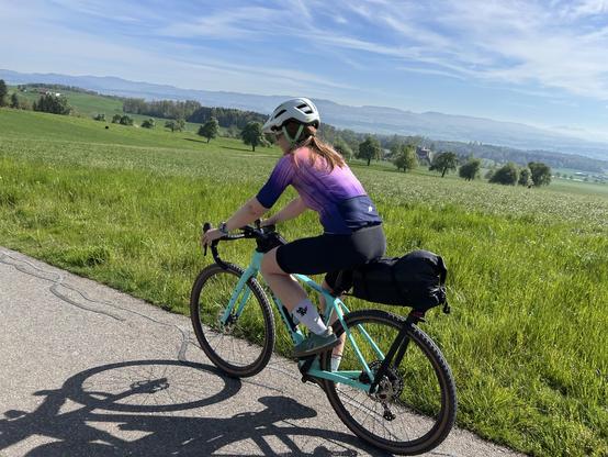 A cyclist with blue skies 