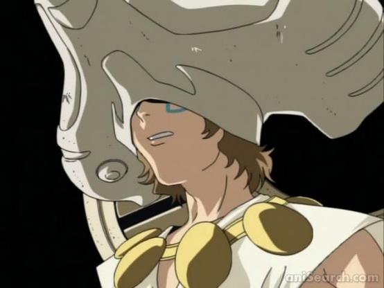 an image of a figure wearing a large mechanical controller helmet, his teeth grimacing, against a black background 