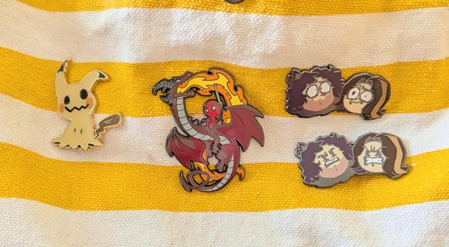 Image shows my very small pin collection on my bag.