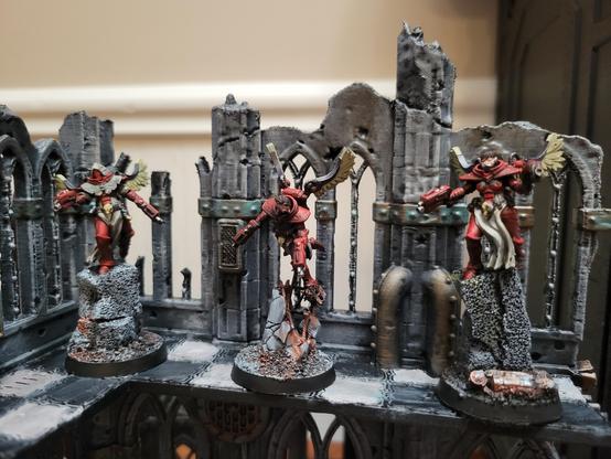Three flying sisters of battle in a ruin
