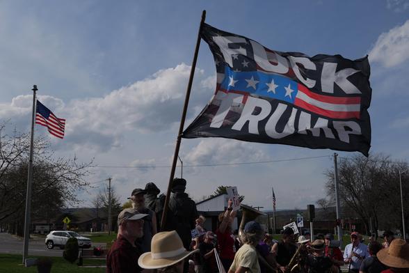 F Trump flag at rally.