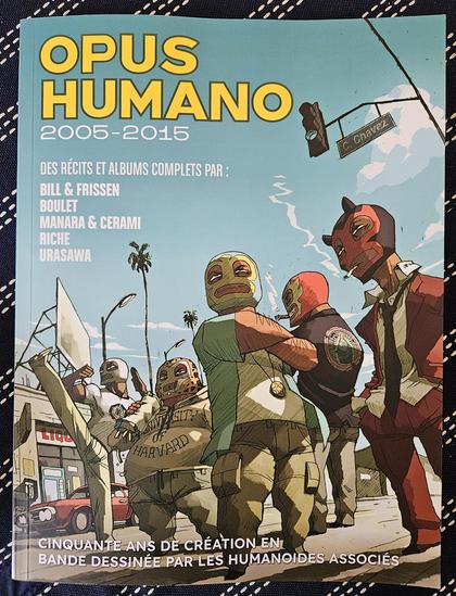 The cover of the 4th volume of the OPUS HUMANO collection celebrating the 50 years of Humanoïdes Associés, the publishing house at the origin of the Métal Hurlant science fiction magazine. Cover art: Luchadores Five, by Bill.