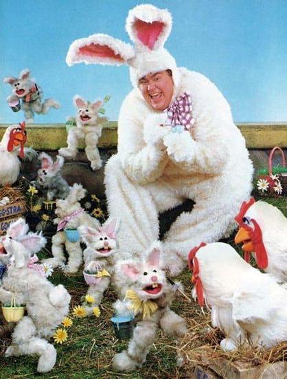John Candy dressed as an easter bunny with other Easter bunnies on The Muppet Show.