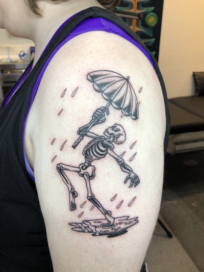 Skeleton dancing in the rain by Mitch Wolff Tattoons