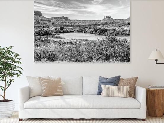 A black and white view of the Colorado River flowing through a rustic but beautiful desert landscape with the Parriott Mesa in the background towards the right. This is located in Moab, Utah near the Hittle Bottom Campground and Mary Jane Canyon @fineartamerica https://5-jennifer-white.pixels.com/featured/parriott-mesa-and-colorado-river-grayscale-jennifer-white.html
#buyintoart #photography #landscapephotography #largeart #utahphotography 