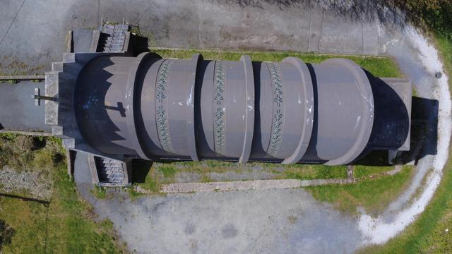 Vertical drone view of the concrete ribbed roof. The ribs were too thin at their apexes and roof leaks have plagued the church since the beginning. The structure continued to deteriorate, even after a 2011 restoration and is currently closed.