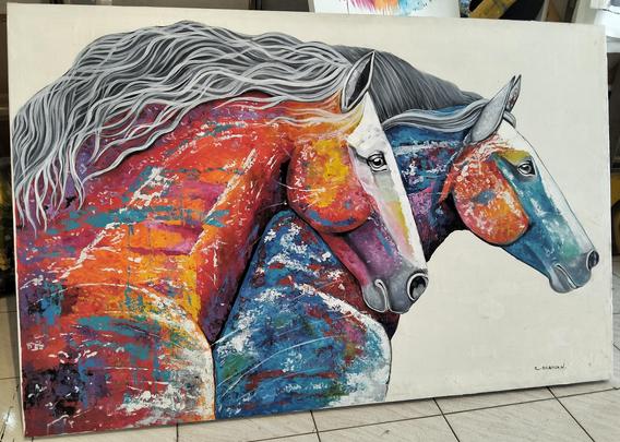 two horses galloping side by side, seen from the side, one is mostly blue and purple with some orange, the other mostly red and orange and yellow with some blue, their hair silver, against a white background 