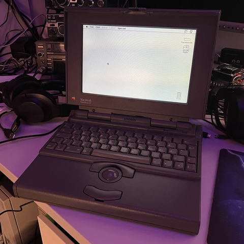 Photo of the Powerbook 145 at an angle from the front booted into System 7.1