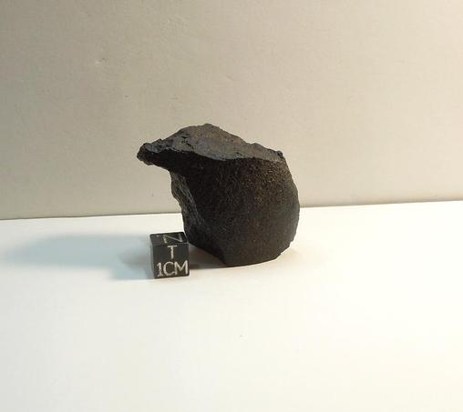 Unclassified NWA meteorite with fusion crust.