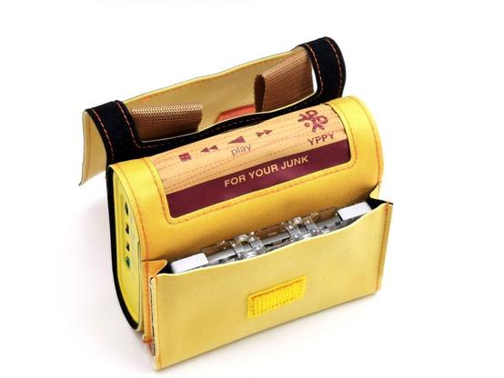 A Sony YP-EW22 portable cassette player, which looks like something from a Wes Anderson film or like part of a scout ensemble. It looks like a small yellow satchel with a player in the middle.