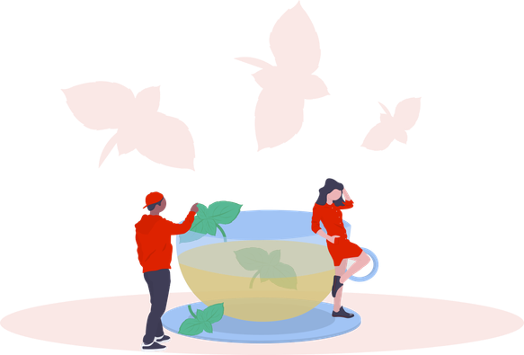 A woman and a man besides an out-sized cup of tea.