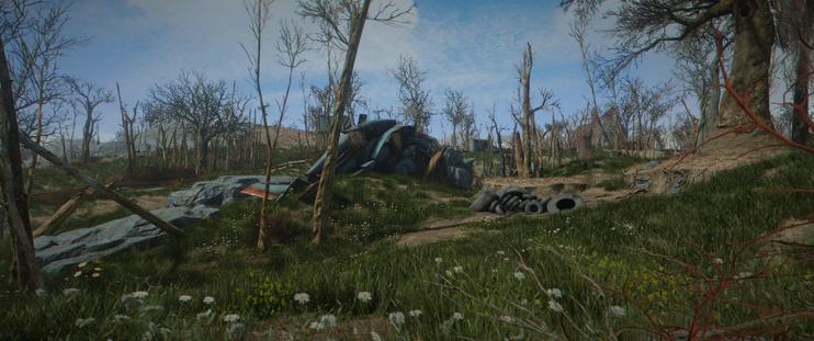 screenshot of Fallout 4 showing a crashed Vertibird on a lush green hill with dead trees spread around it