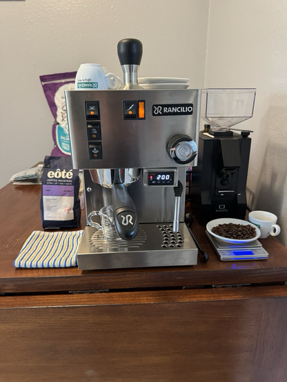 Espresso machine setup on my kitchen table, Rancilio Sylvia V2, Eureka Silenzio coffee grinder, eôte coffee from OKC, USA