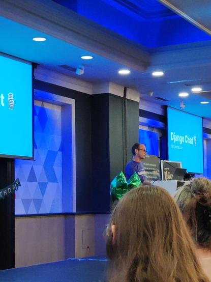 Carlton on stage with his slides