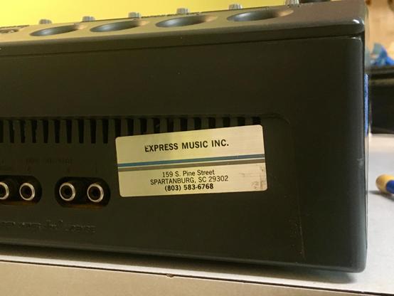 On the rear of a Tascam 424mkII multitrack cassette recorder is a silver foil sticker for a now-defunct repair shop, Express Music in Spartanburg, SC, where this machine was likely worked on back in the day.
