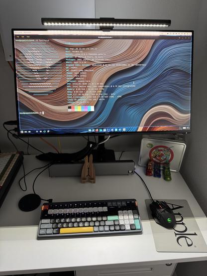 A photo of COSMICdesktop running on a miniPC (not pictured).