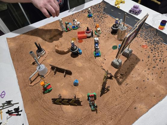 Two teams of Lego minifigures drunkenly brawling in the desert. Star Wars vs Minecraft.
