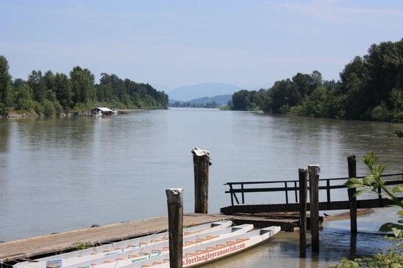 Looking up the wide Fraser River toward the mountains in the distance.