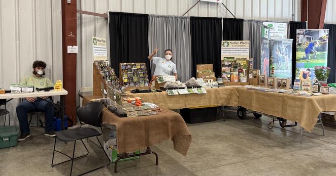 Overall shot of our booth at the garden show. Two of our owners, 3 tables and loads of stuff you need for your garden!