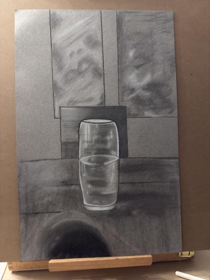 Drawing of a glass on a table half filled