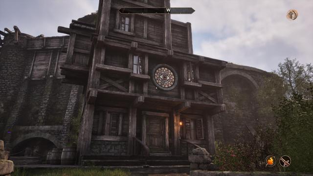 The Bravil Mages Guild Chapter Building, Looks like a delapidated multi-story shack with a stained glass eye logo of the Mages Guild in front.