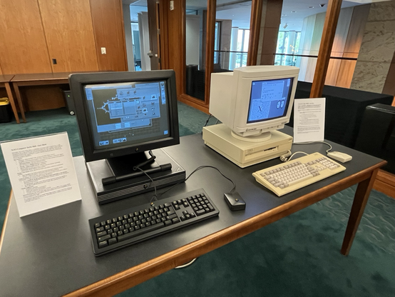 A black NeXT workstation next to an Amiga 3000 (?)