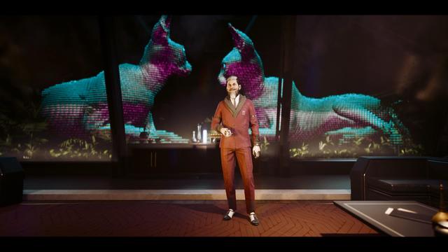 A man dressed in a stylish brown suit stands in a futuristic setting with holographic displays of large, colorful cats in the background. The scene includes modern furnishings and a bar area.