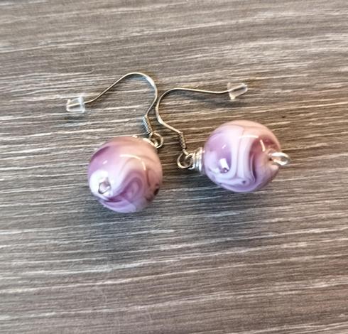 Glass bead earrings are purple and white 