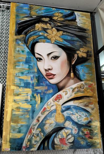 a painting of a woman in gold and blue and red patterned floral fabrics, her hair wrapped in blue and gold, looking towards the viewer, seen from her chest up from the side, behind her are gold and blue brush strokes in different tones